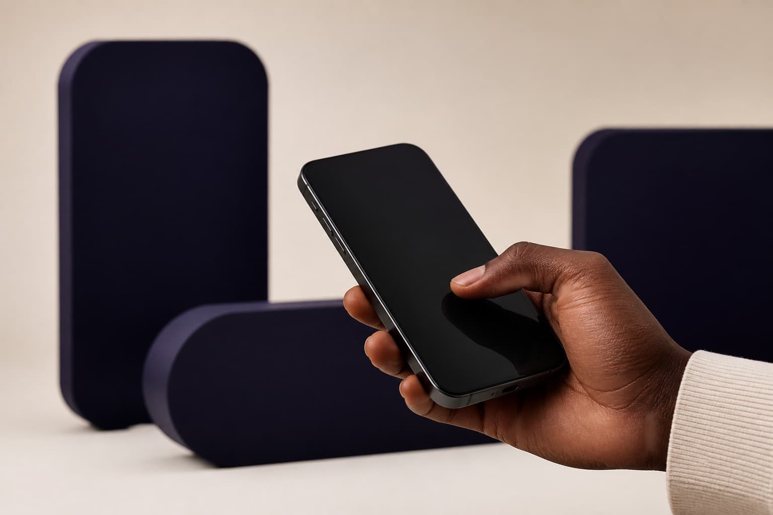 A hand holding a phone, ready for a Mobile Money withdrawal